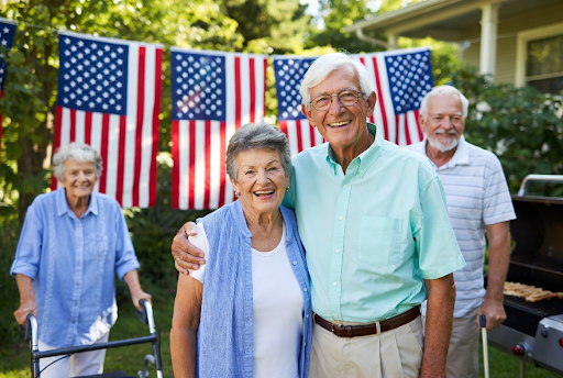 Senior couple using a rollator at an outdoor Memorial Day event