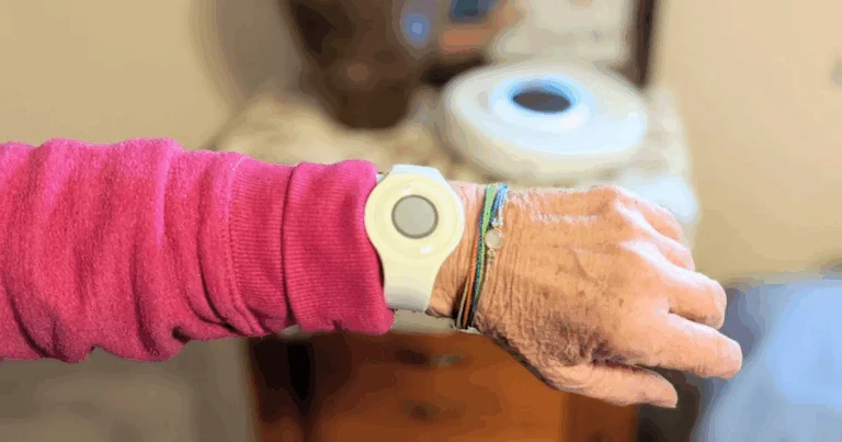 Medical alert button worn on the wrist