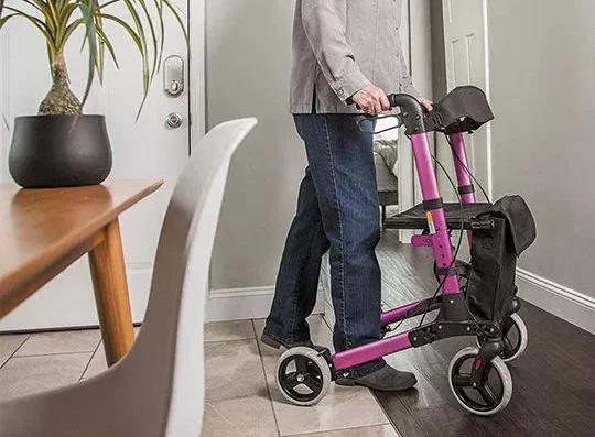Person using a wheeled walker at home