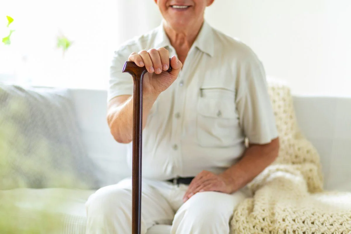 Senior holding a cane